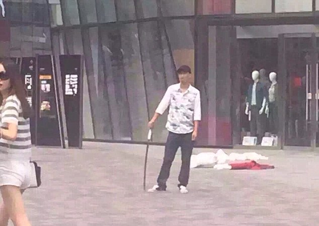 Armed attacker: A man armed with a metre-long sword stabbed a woman to death in Beijing today